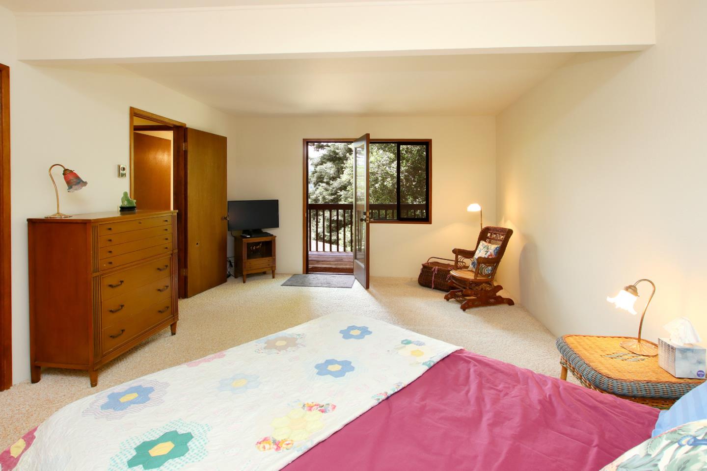 17 Pleasant Heights Drive Aptos, CA 95003 - Photo 20 of 21 a bedroom with a bed and wooden floor