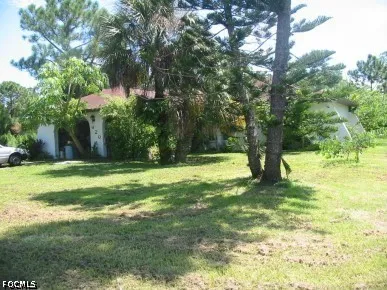 a view of swimming pool with a yard