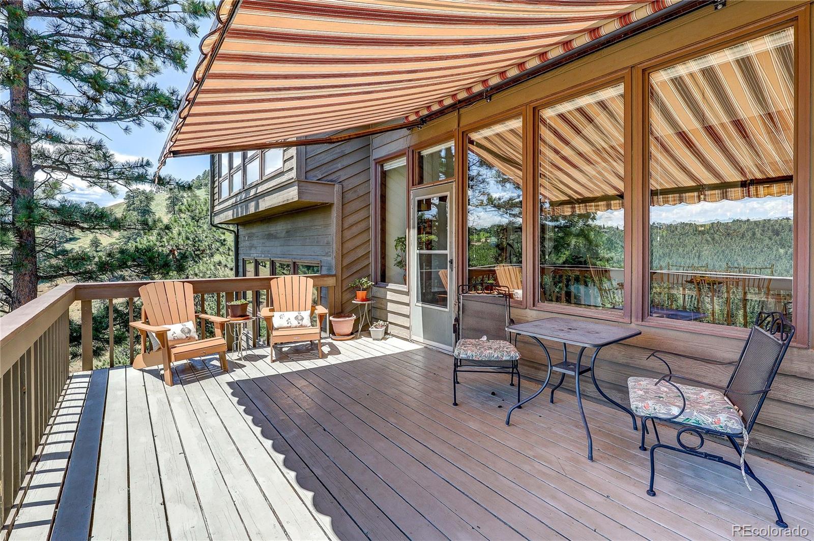 147 Alpine Avenue Golden, CO 80401 - Photo 15 of 47 a view of a patio with chairs and wooden floor