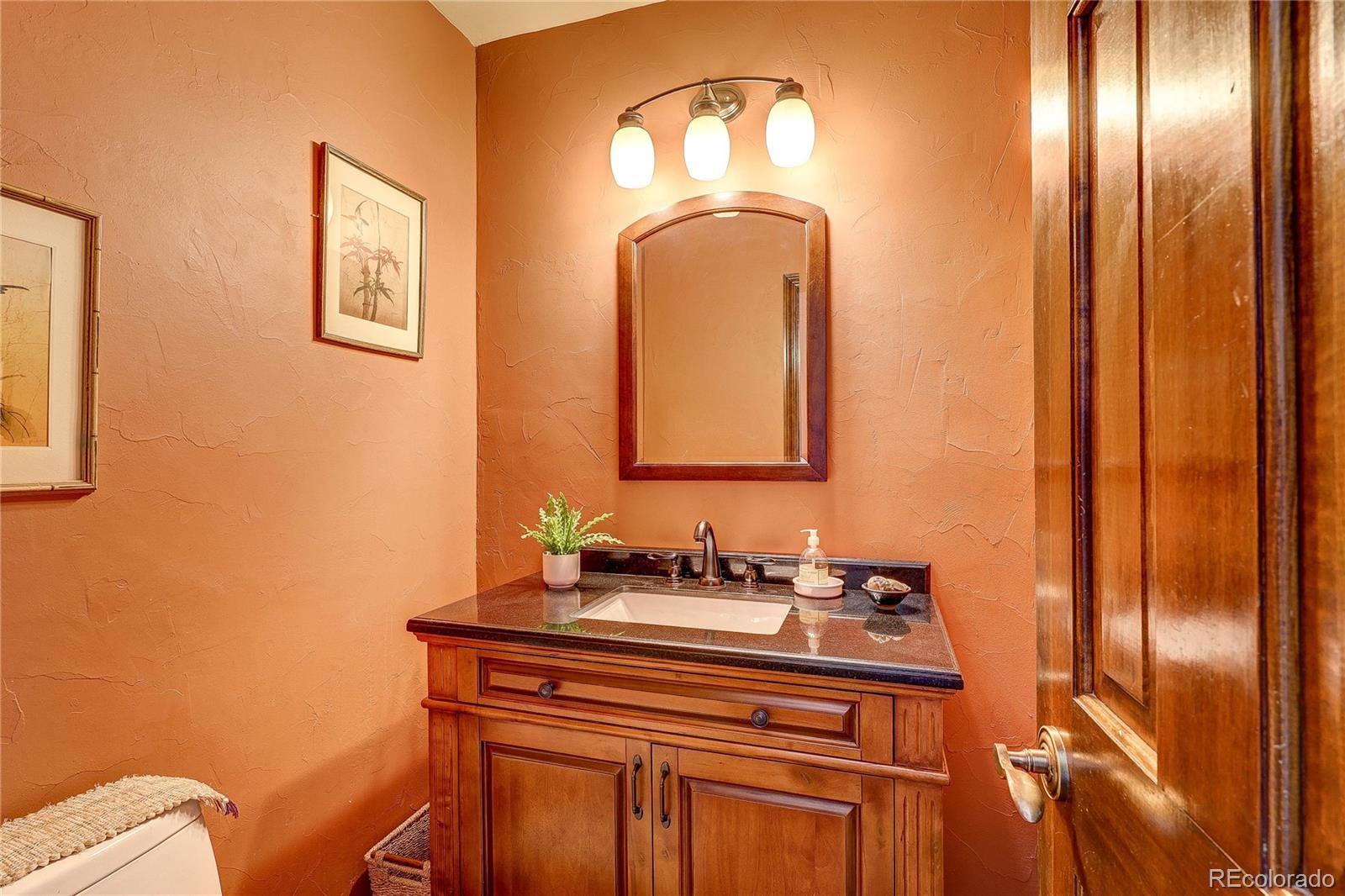147 Alpine Avenue Golden, CO 80401 - Photo 18 of 47 a bathroom with a sink mirror and vanity