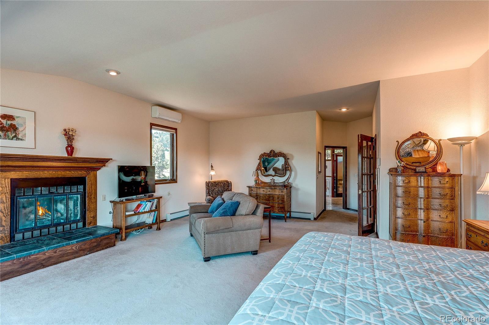 147 Alpine Avenue Golden, CO 80401 - Photo 21 of 47 a living room with furniture and a fireplace