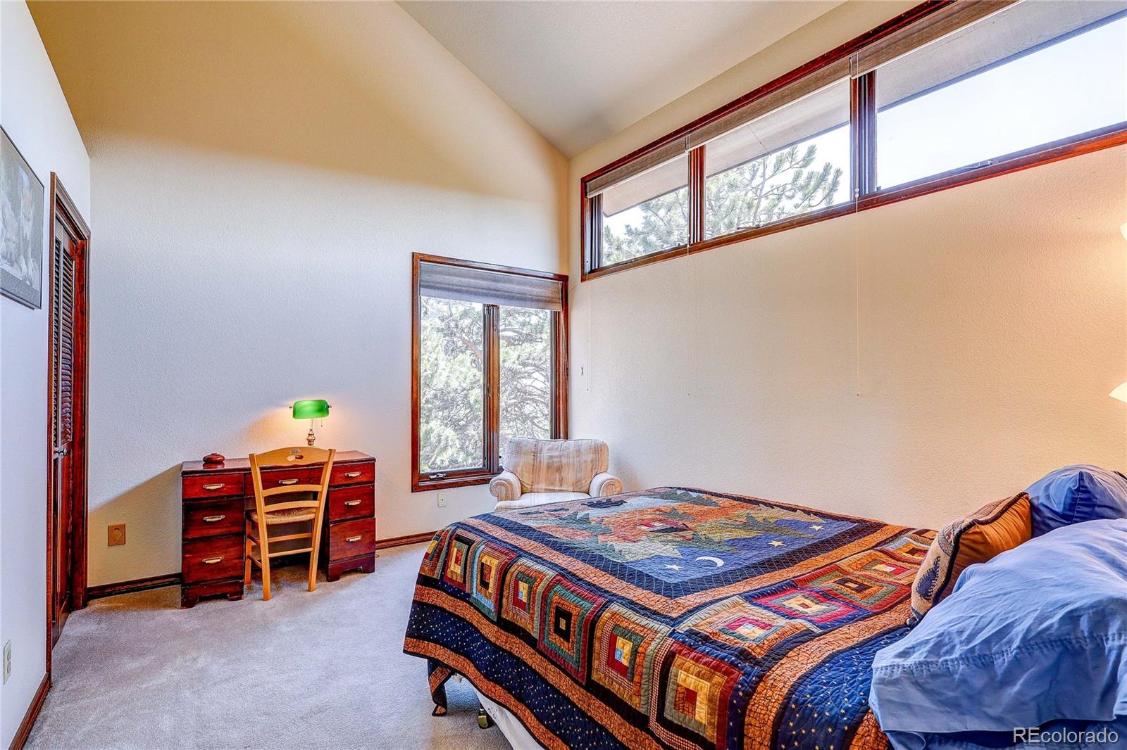 147 Alpine Avenue Golden, CO 80401 - Photo 27 of 47 a bedroom with a bed and a window