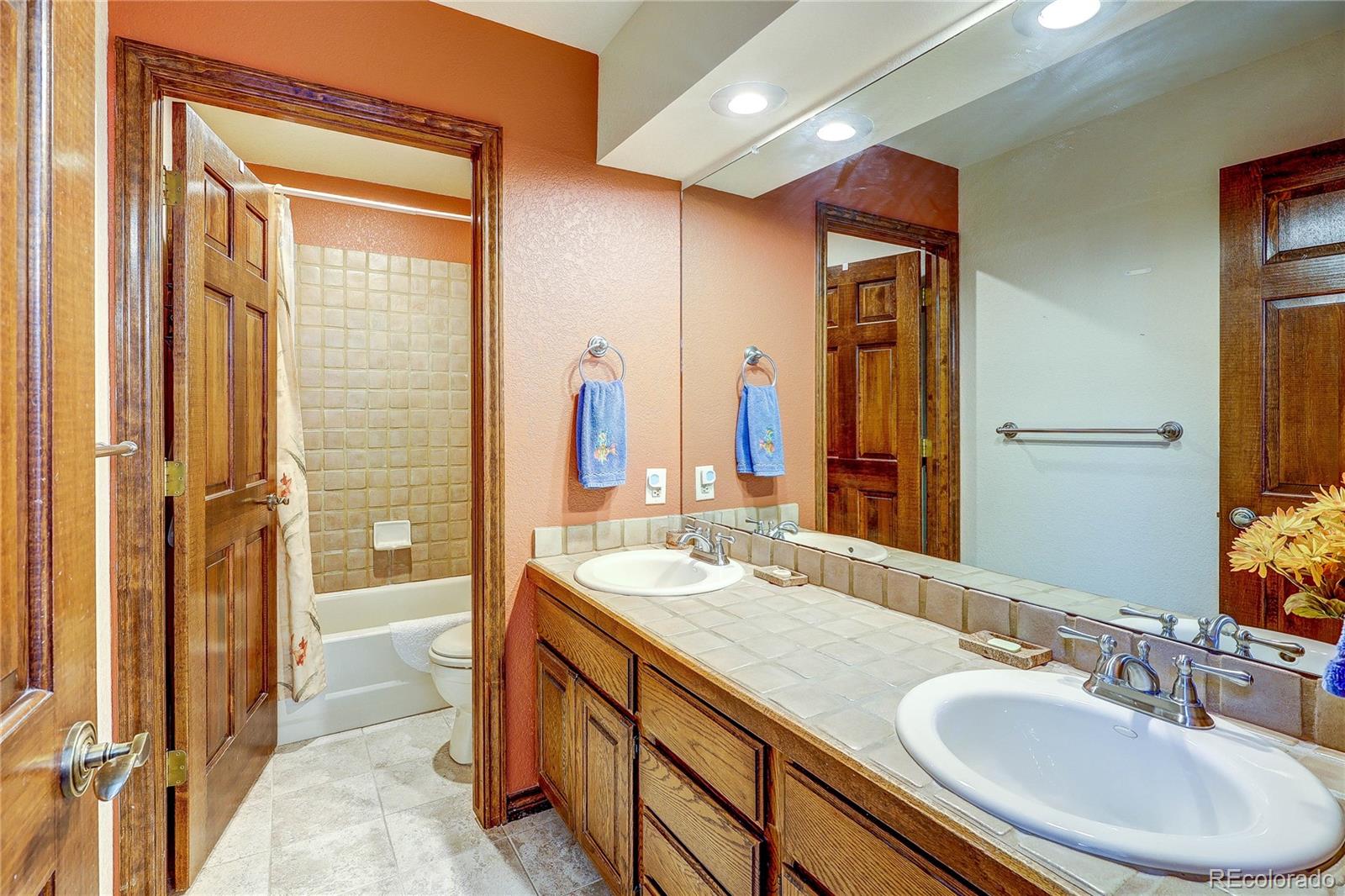 147 Alpine Avenue Golden, CO 80401 - Photo 28 of 47 a bathroom with a sink double vanity and a mirror
