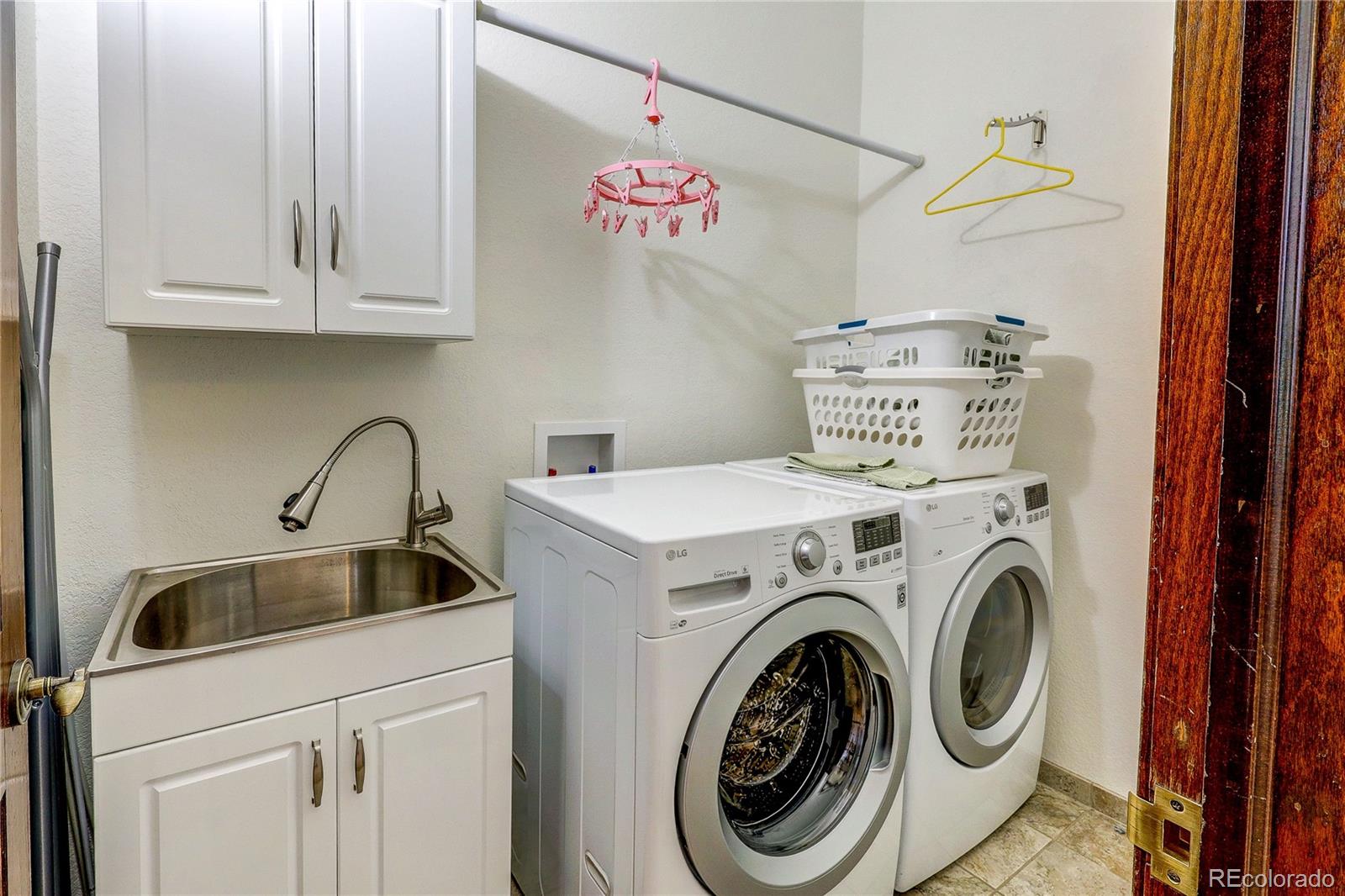 147 Alpine Avenue Golden, CO 80401 - Photo 29 of 47 a utility room with dryer and washer