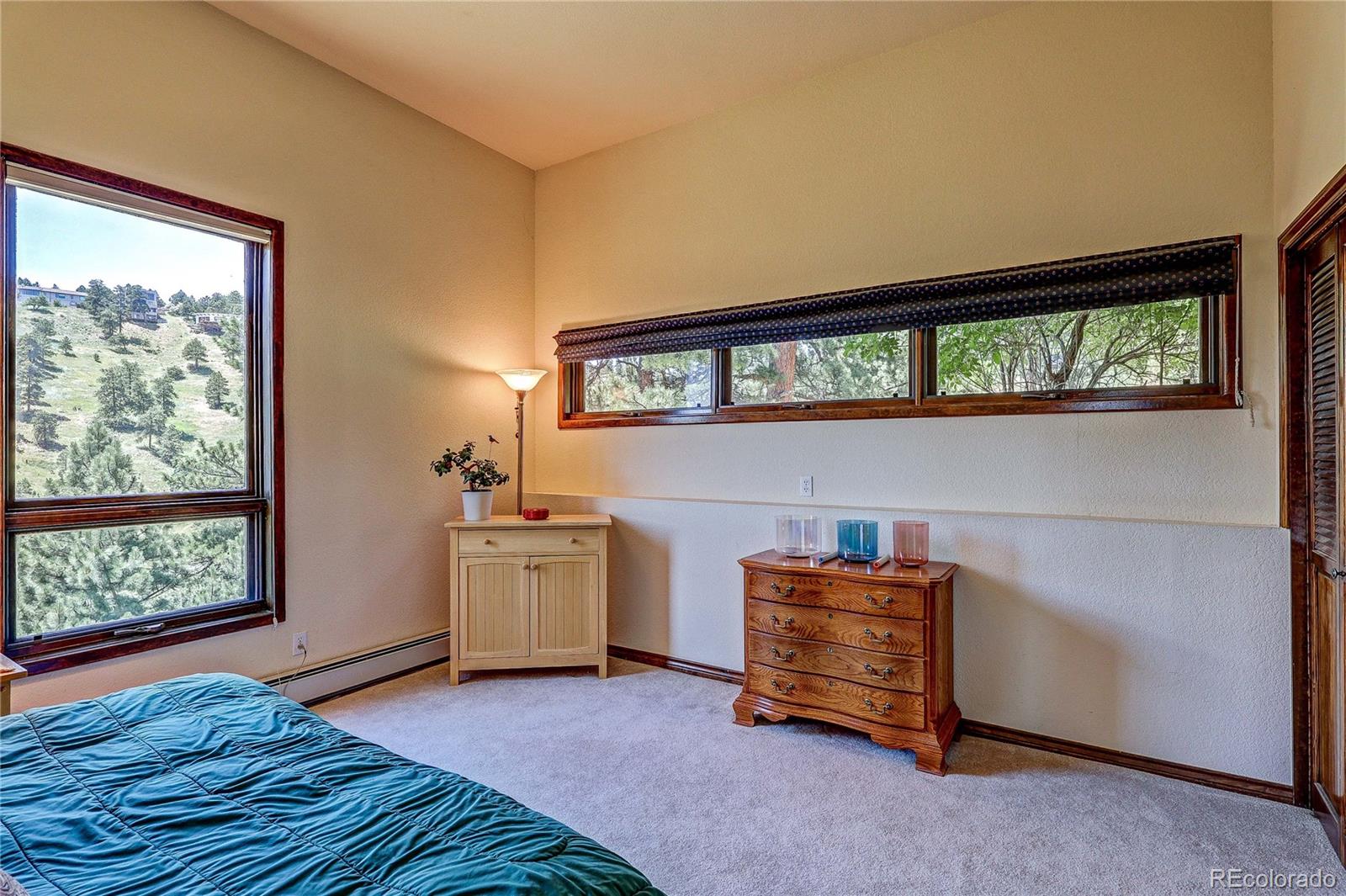 147 Alpine Avenue Golden, CO 80401 - Photo 30 of 47 a bedroom with a bed and a window