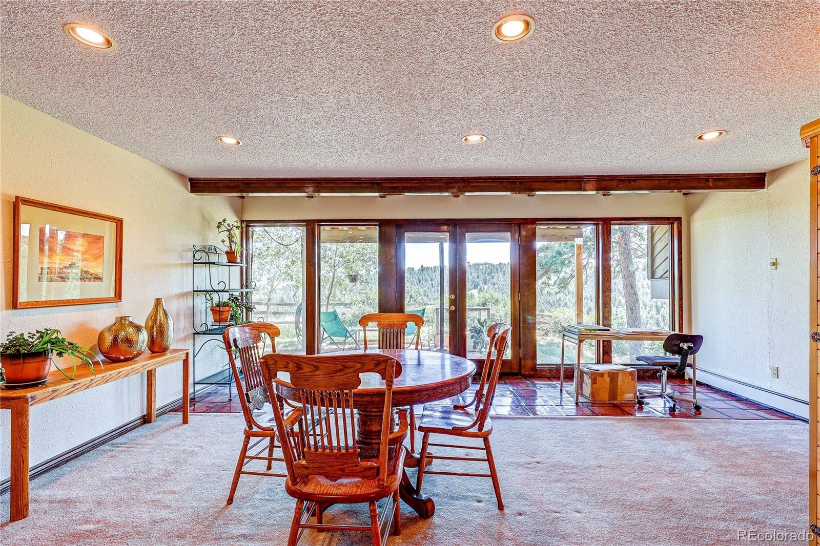 147 Alpine Avenue Golden, CO 80401 - Photo 31 of 47 a view of a dining room with furniture window and outdoor space