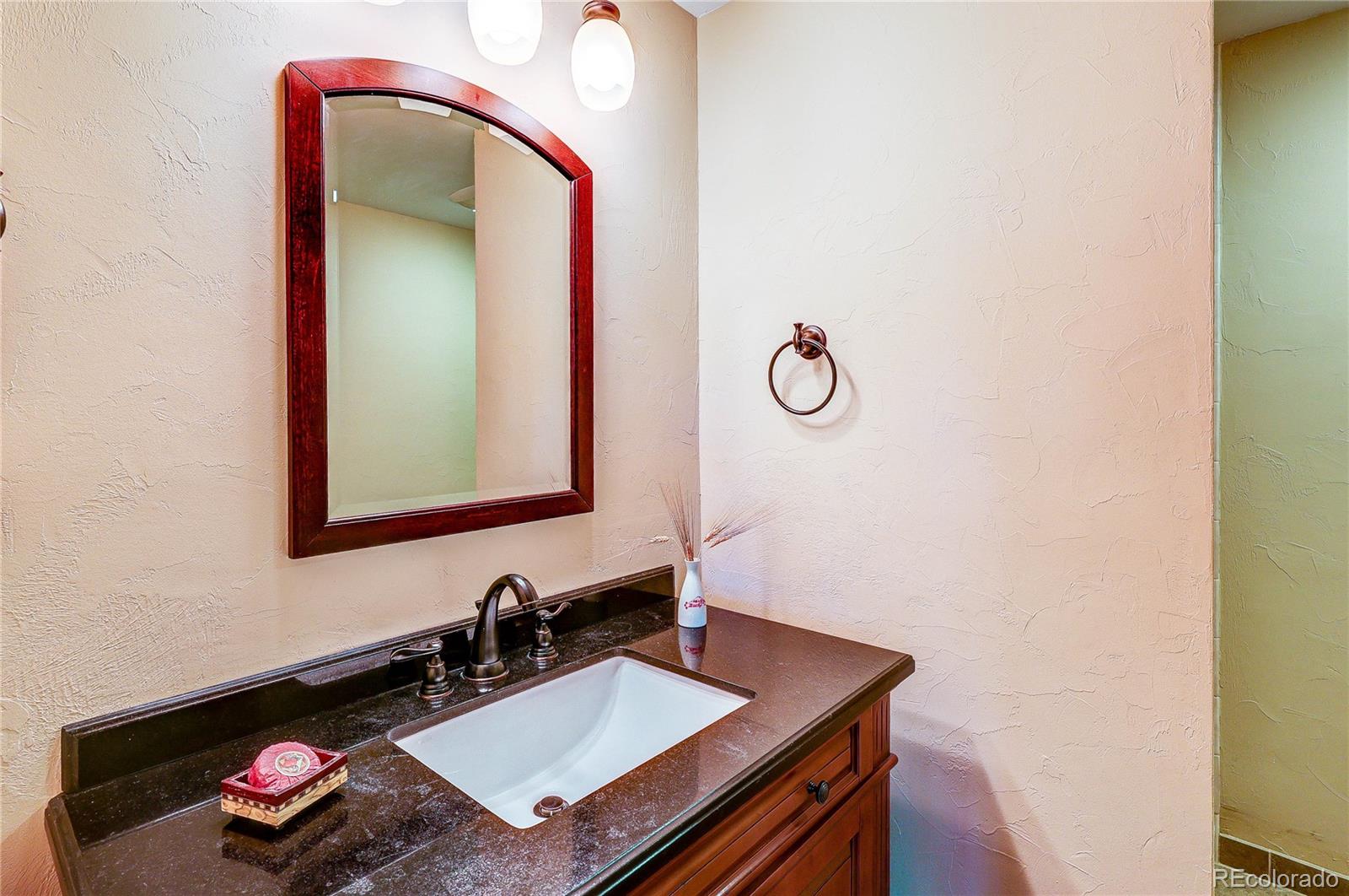 147 Alpine Avenue Golden, CO 80401 - Photo 33 of 47 a bathroom with a sink and a mirror