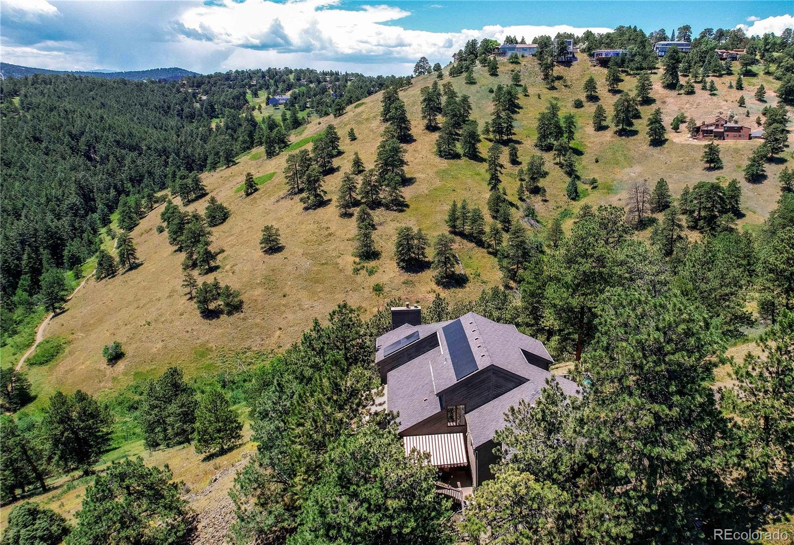 147 Alpine Avenue Golden, CO 80401 - Photo 39 of 47 a view of a house with a yard and lake view