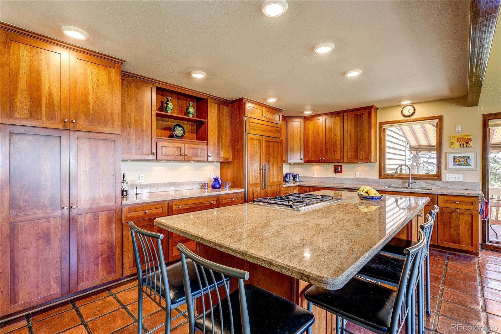 147 Alpine Avenue Golden, CO 80401 - Photo 5 of 47 a kitchen with stainless steel appliances granite countertop a stove a sink dishwasher and a refrigerator with wooden cabinets