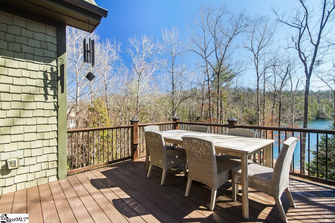 206 Feather Bell Lane Sunset, SC 29685 - Photo 13 of 50 This spacious outdoor living area offers serene lake views, perfect for relaxation or entertaining.