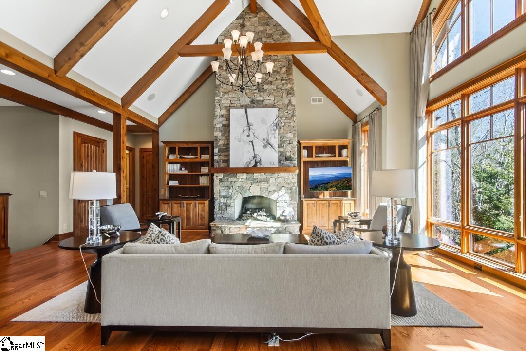 206 Feather Bell Lane Sunset, SC 29685 - Photo 14 of 50 This airy living space features expansive windows and a grand stone fireplace.