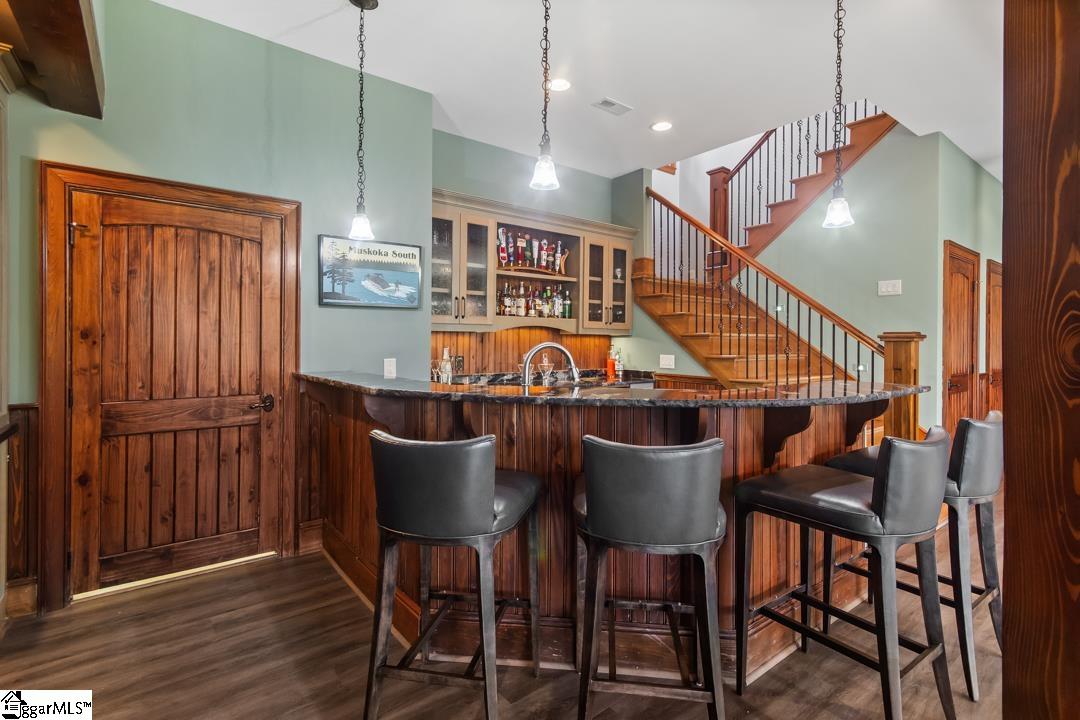 206 Feather Bell Lane Sunset, SC 29685 - Photo 32 of 50 An engaging space features a well-appointed wet bar, ideal for entertaining and daily living.