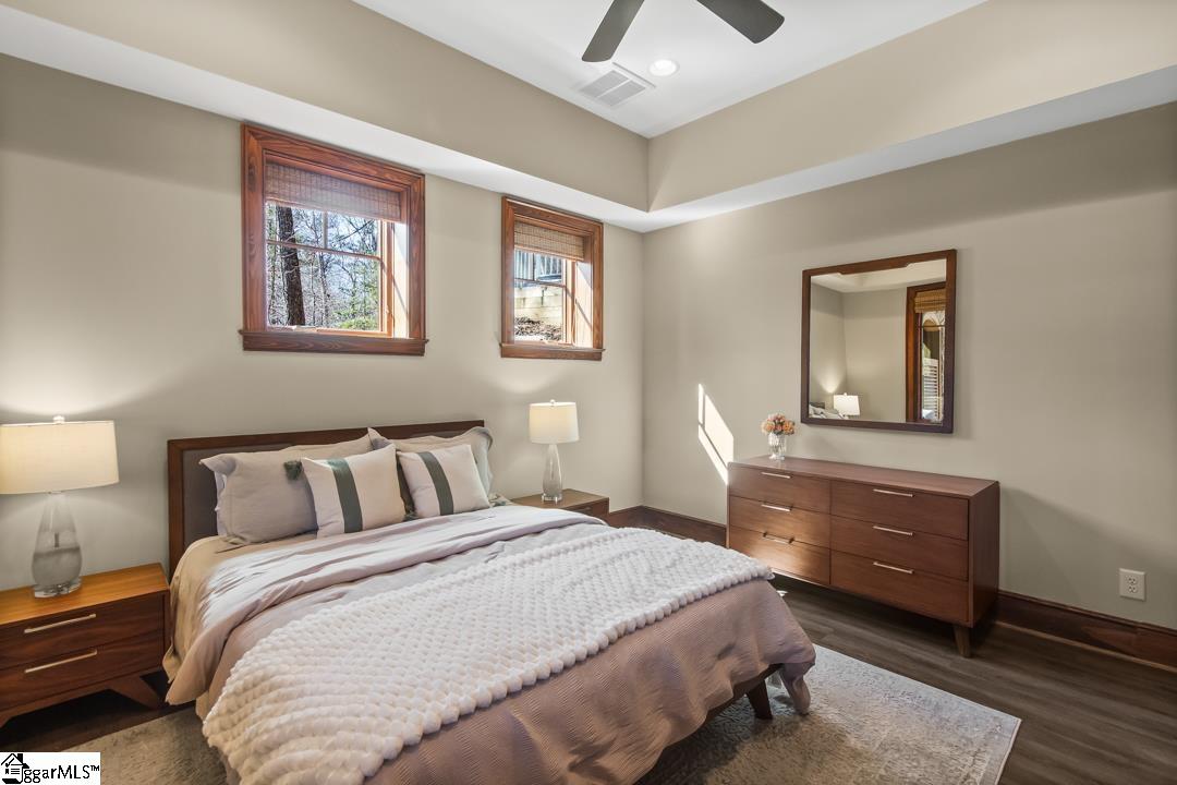 206 Feather Bell Lane Sunset, SC 29685 - Photo 37 of 50 This tranquil sleeping space offers hardwood floors and a ceiling fan for comfort.