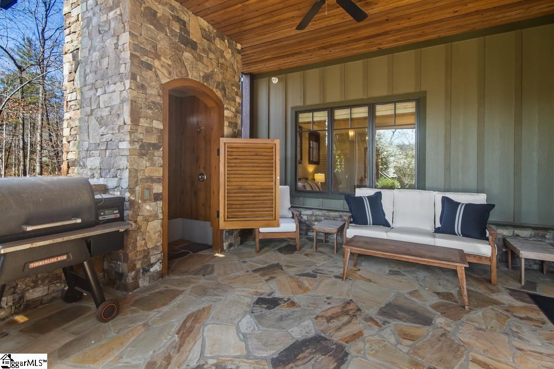 206 Feather Bell Lane Sunset, SC 29685 - Photo 39 of 50 Enjoy outdoor living on this expansive stone patio, perfect for relaxation and entertaining.
