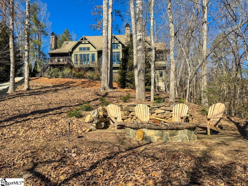 206 Feather Bell Lane Sunset, SC 29685 - Photo 42 of 50 This secluded woodland retreat offers a charming outdoor fire pit, perfect for gatherings under the stars.