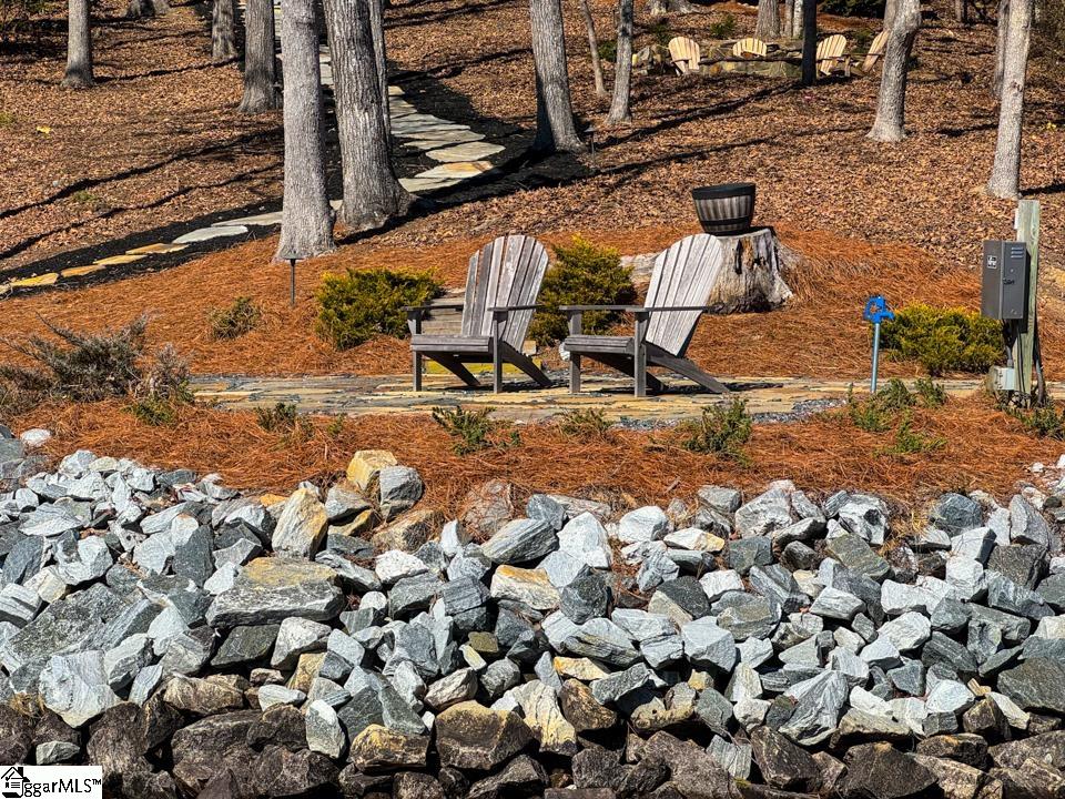 206 Feather Bell Lane Sunset, SC 29685 - Photo 45 of 50 This waterfront retreat offers a charming pathway leading to peaceful seating and your boat.