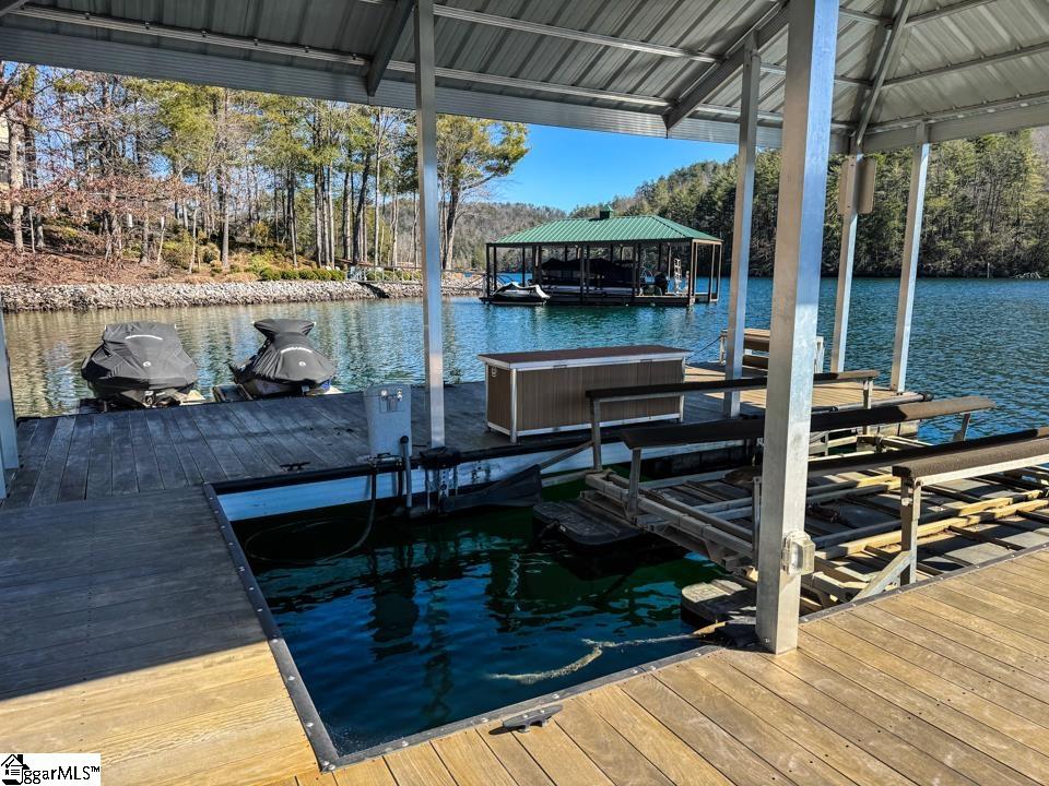 206 Feather Bell Lane Sunset, SC 29685 - Photo 47 of 50 This tranquil waterfront retreat offers a private covered dock to protect your boat.