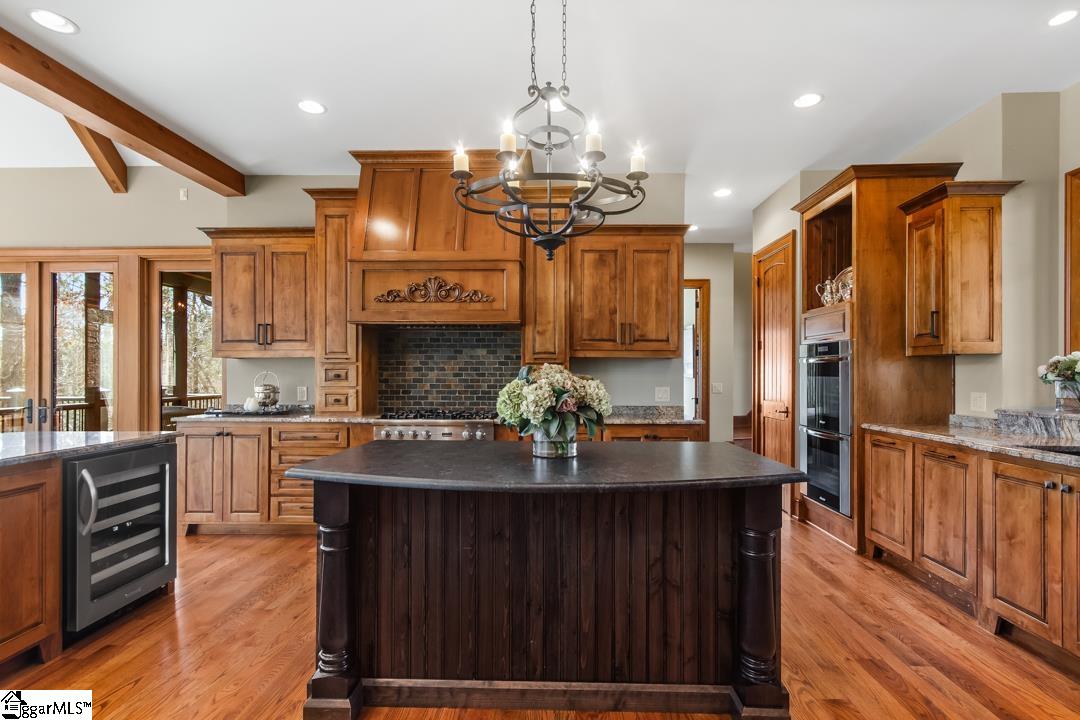 206 Feather Bell Lane Sunset, SC 29685 - Photo 6 of 50 This kitchen features a large island and ample cabinetry, ideal for culinary pursuits.