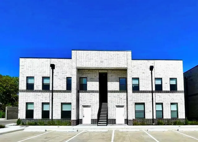 a view of a building with a street