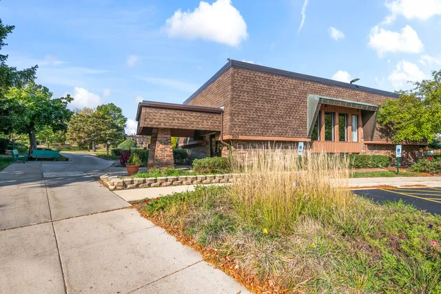 a view of a house with backyard porch and sitting area