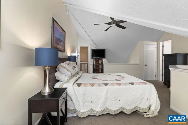 a large white bed in a white room