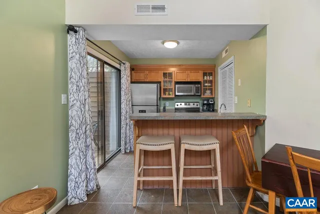 a kitchen with a sink cabinets and window