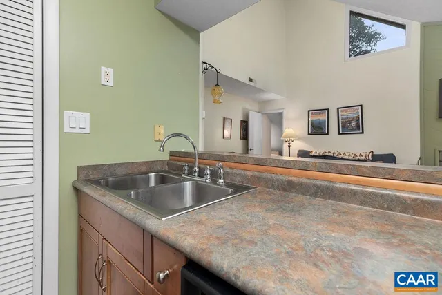 a kitchen with a sink and a vanity