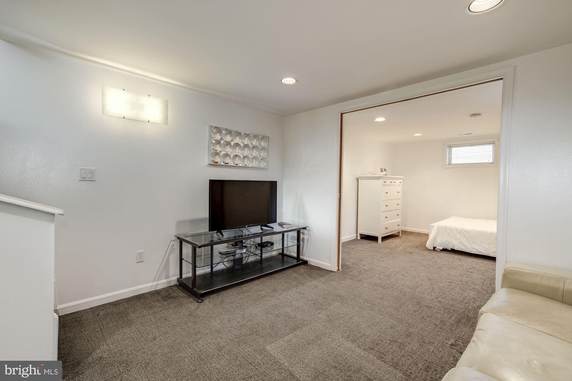 5606 Chesterbrook Road Bethesda, MD 20816 - Photo 20 of 29 Recreation room opens to bonus room