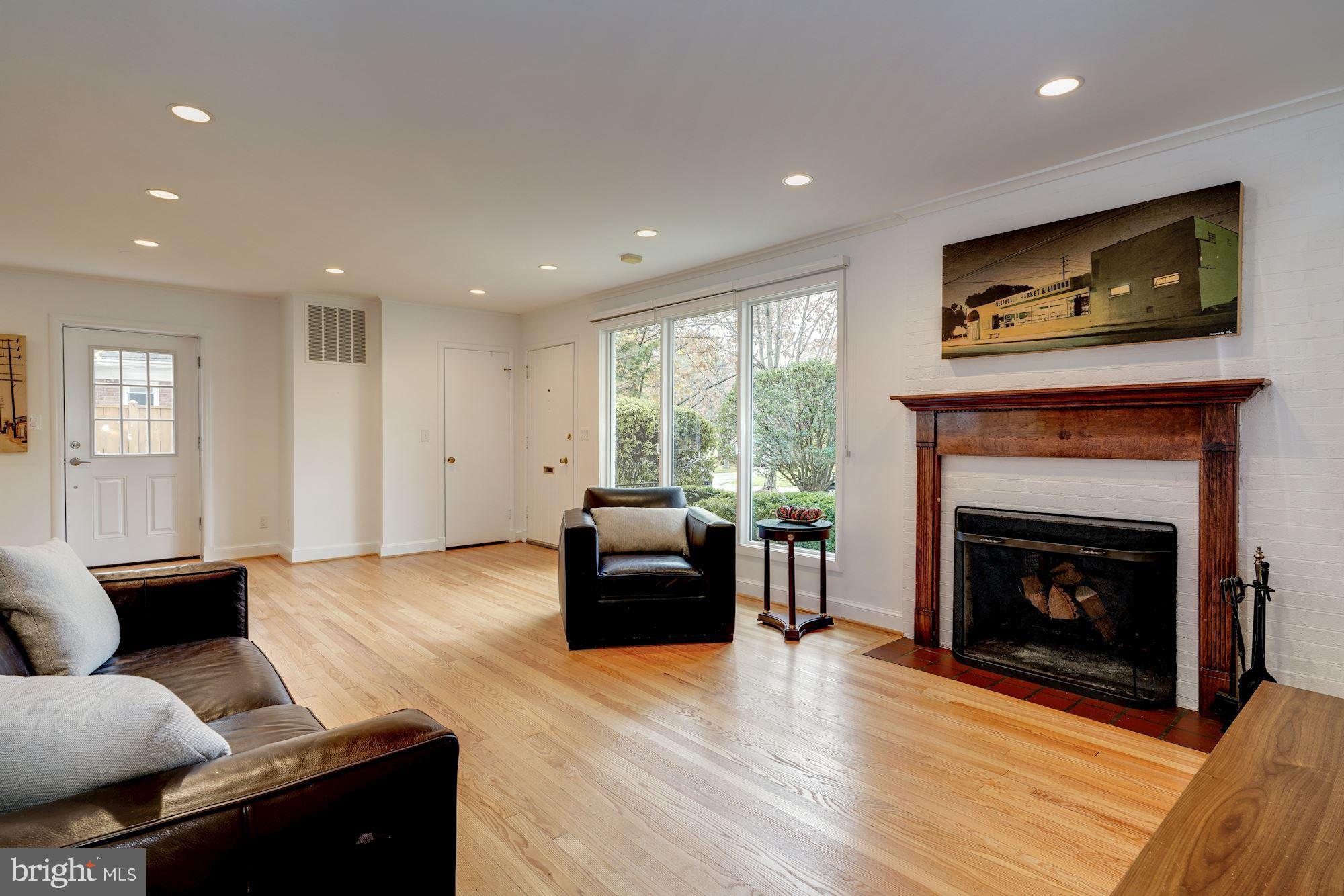 5606 Chesterbrook Road Bethesda, MD 20816 - Photo 5 of 29 Sunny Living Room w/wood burning fireplace
