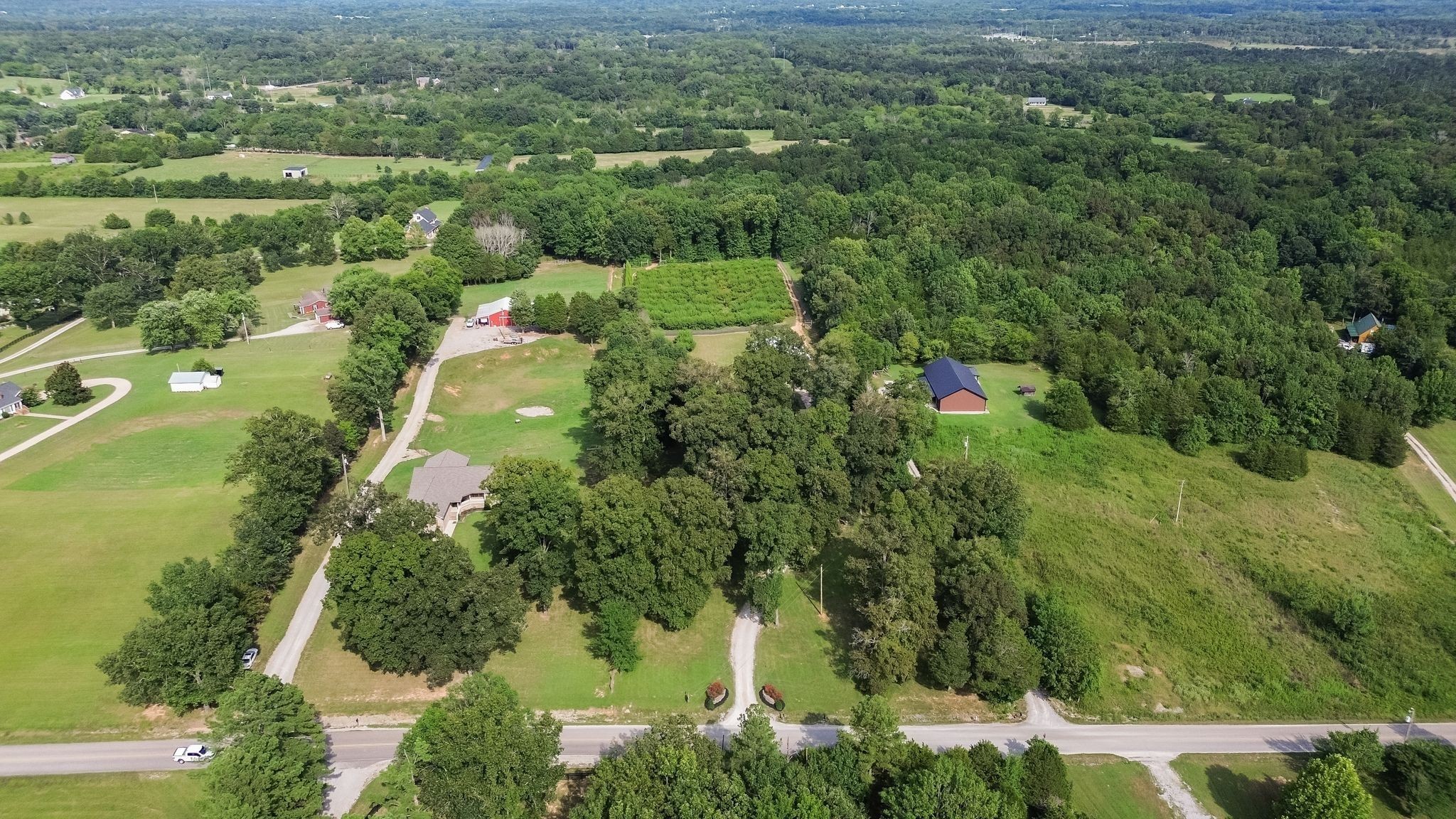 2350 Joe Brown Road Spring Hill, TN 37174 - Photo 14 of 80 an aerial view of residential houses with outdoor space and trees