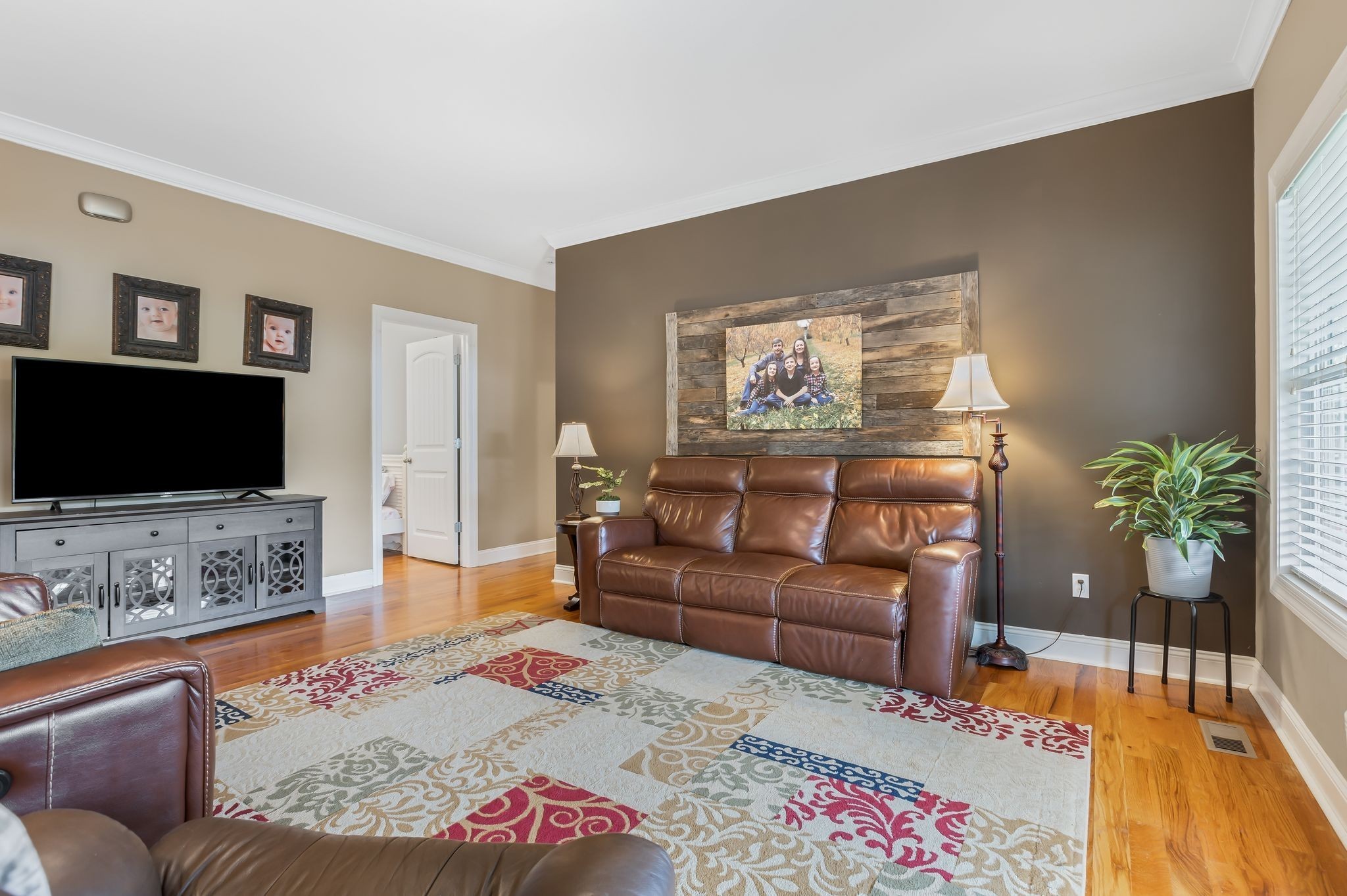 2350 Joe Brown Road Spring Hill, TN 37174 - Photo 32 of 80 a living room with furniture and a flat screen tv