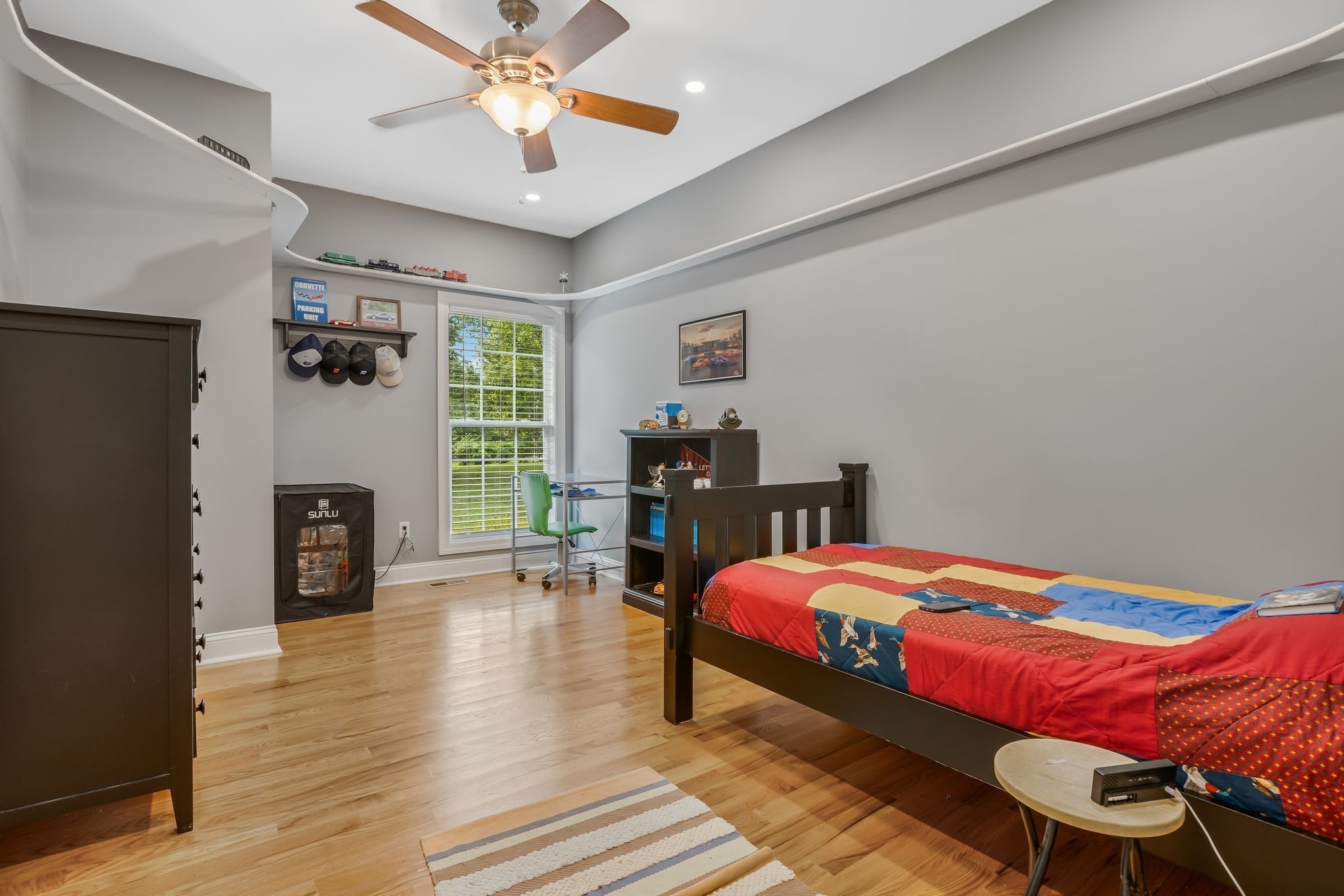 2350 Joe Brown Road Spring Hill, TN 37174 - Photo 37 of 80 a bedroom with a bed and a fireplace