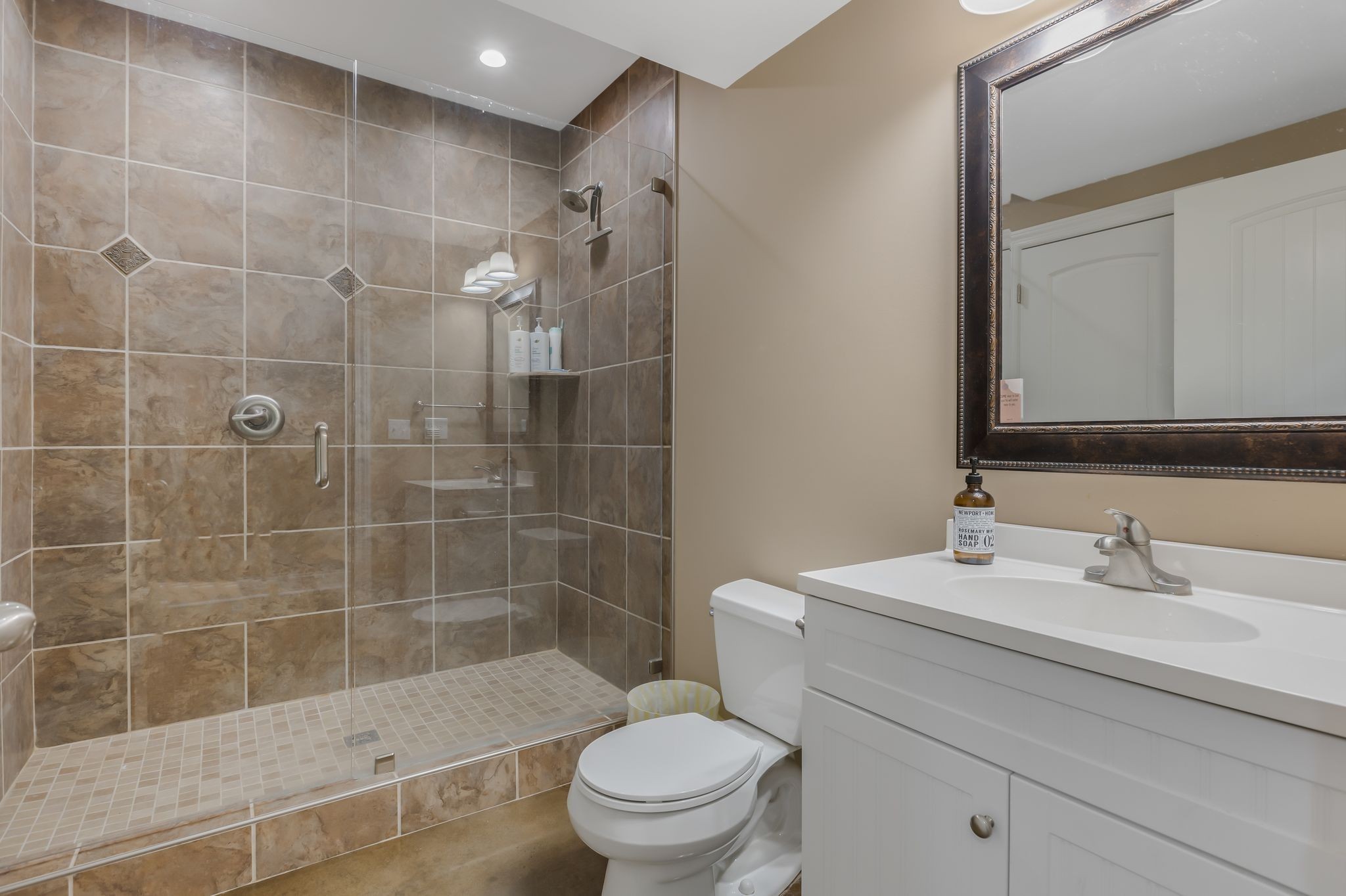 2350 Joe Brown Road Spring Hill, TN 37174 - Photo 46 of 80 a bathroom with a sink a toilet and shower