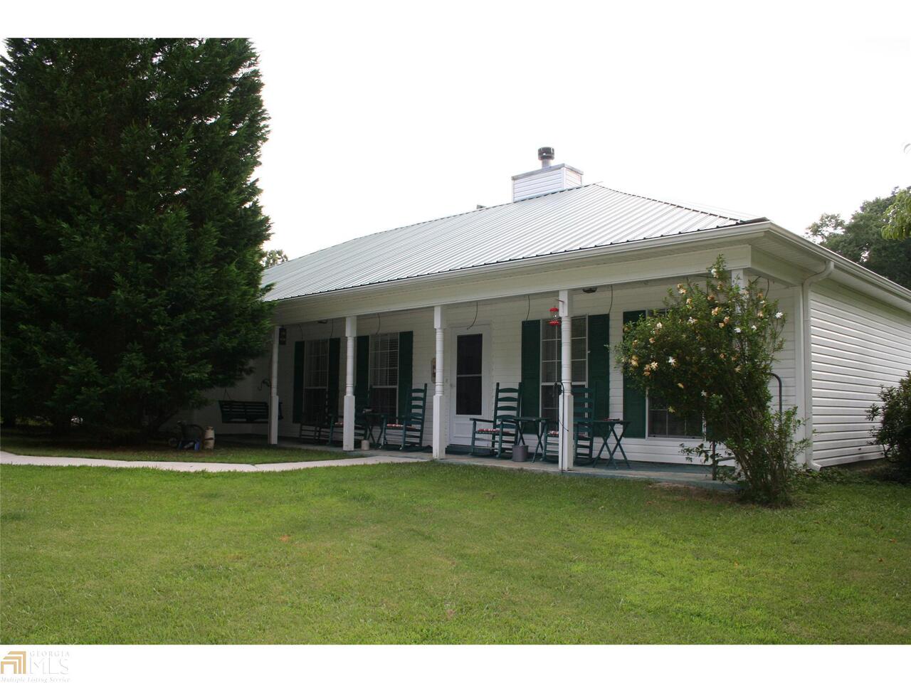 70 Thomas Powers Road Newnan, GA 30263 - Photo 1 of 1 a front view of house with outdoor seating and yard