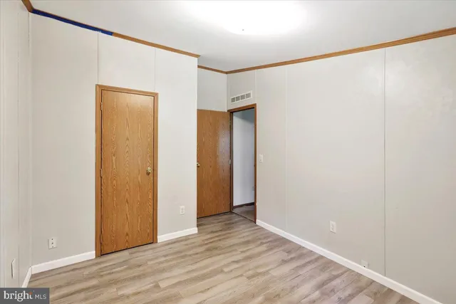 a workspace with furniture and wooden floor