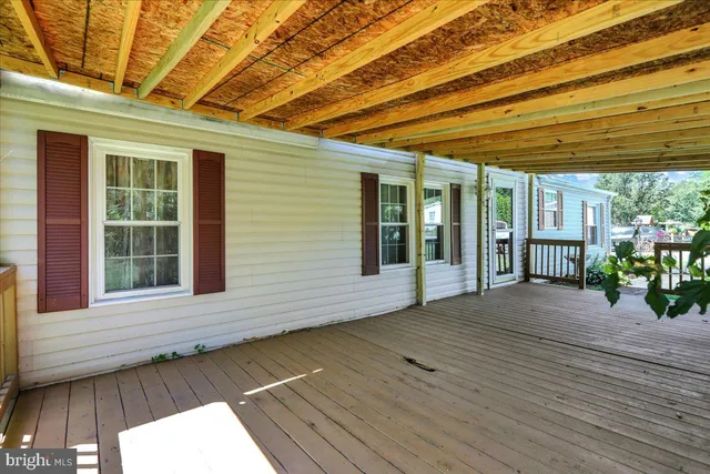 a view of backyard with a garden and outdoor seating