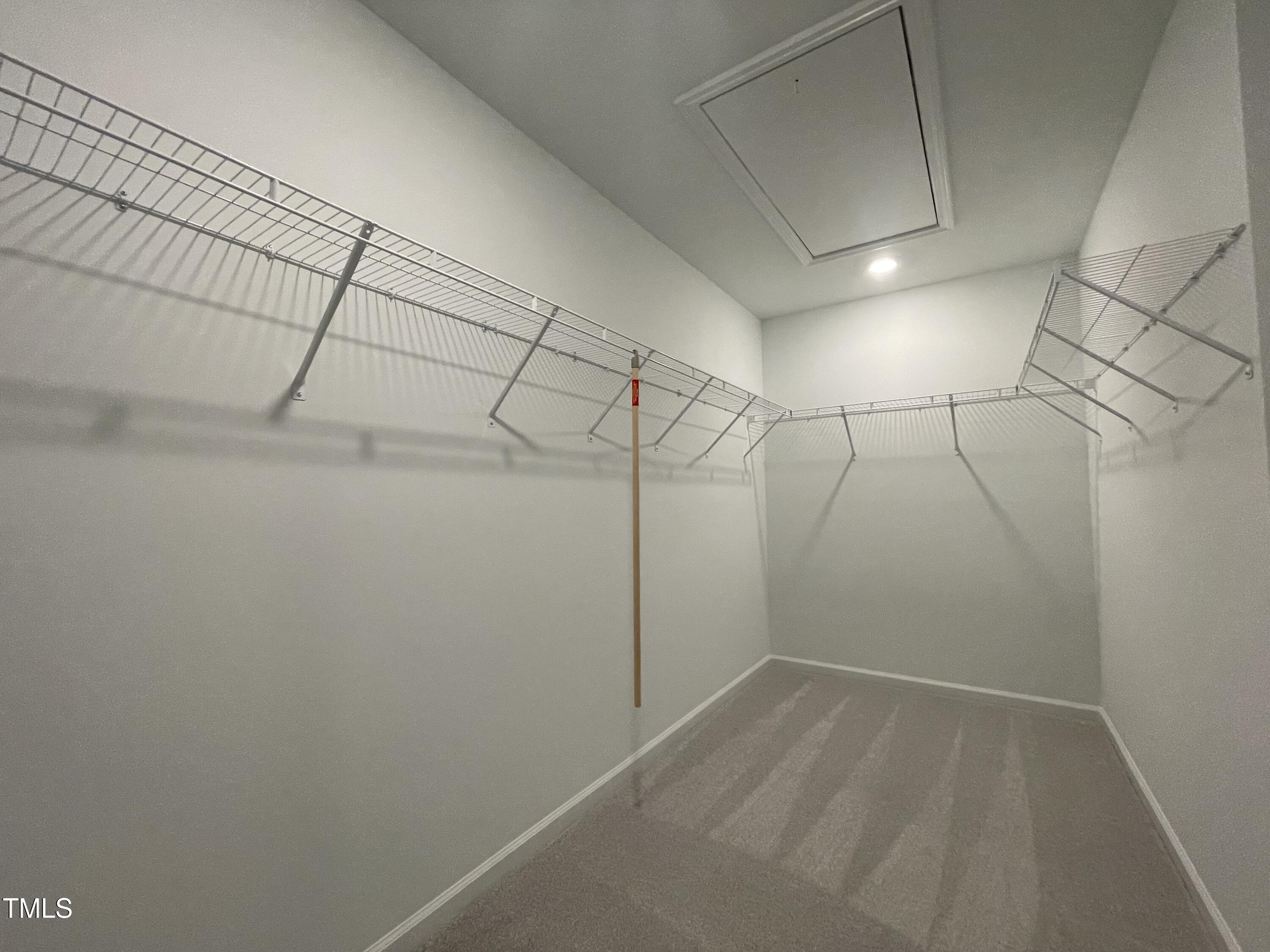 351 Thompson Overlook Way Smithfield, NC 27577 - Photo 8 of 11 a view of a room with racks on the wall