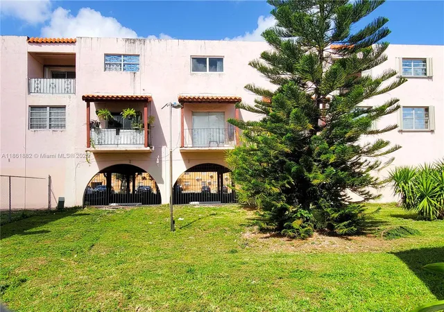 a view of house with yard