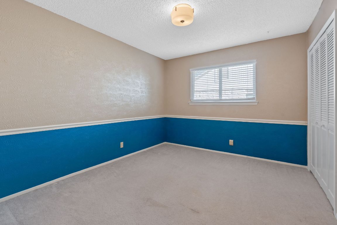 4706 Cap Rock Drive Austin, TX 78735 - Photo 20 of 40 an empty room with windows
