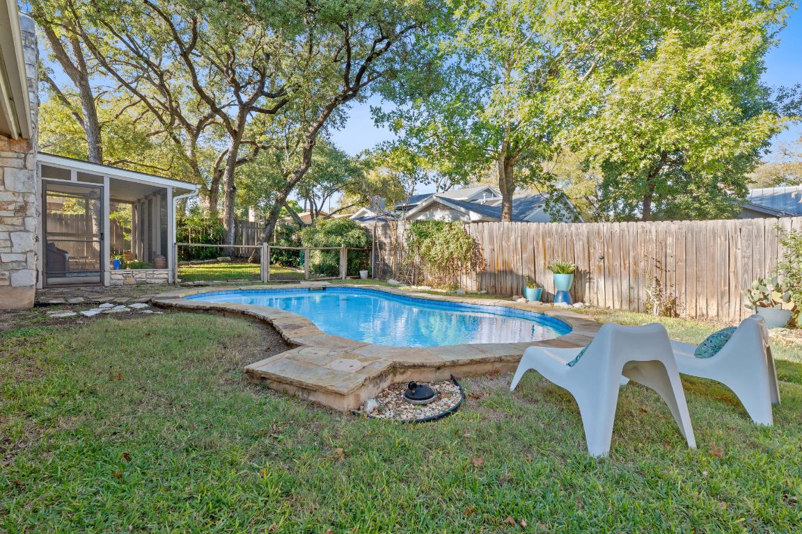 4706 Cap Rock Drive Austin, TX 78735 - Photo 26 of 40 a view of backyard with swimming pool and seating space