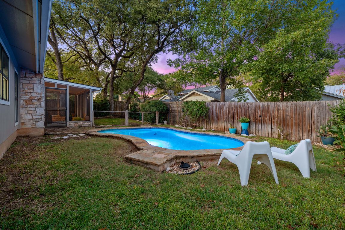 4706 Cap Rock Drive Austin, TX 78735 - Photo 31 of 40 a view of backyard with swimming pool and furniture