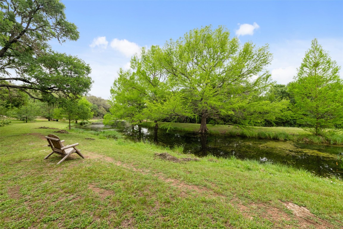 4706 Cap Rock Drive Austin, TX 78735 - Photo 40 of 40 a view of a lake with a yard and swimming pool