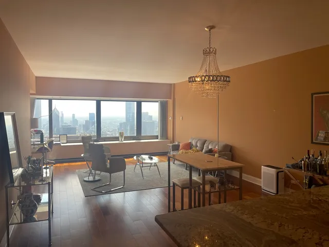 a dining room with furniture window and outside view