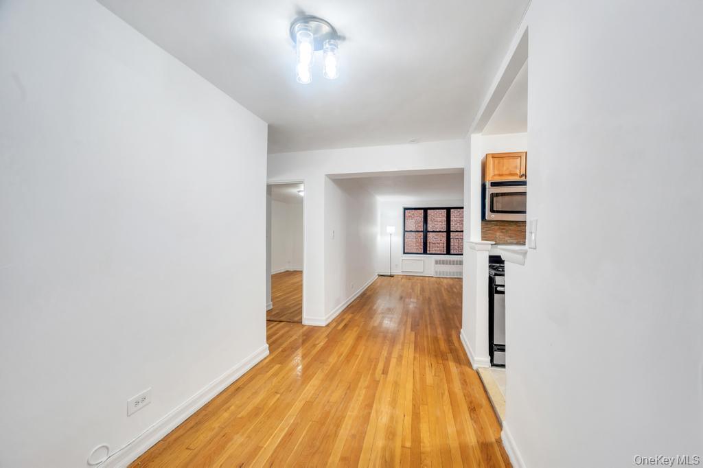 3123 Bailey Avenue, Unit 4A Bronx, NY 10463 - Photo 19 of 27 wooden floor in a hall with an entryway