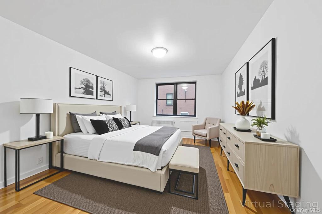 3123 Bailey Avenue, Unit 4A Bronx, NY 10463 - Photo 8 of 27 a large bedroom with a bed wooden floor and window