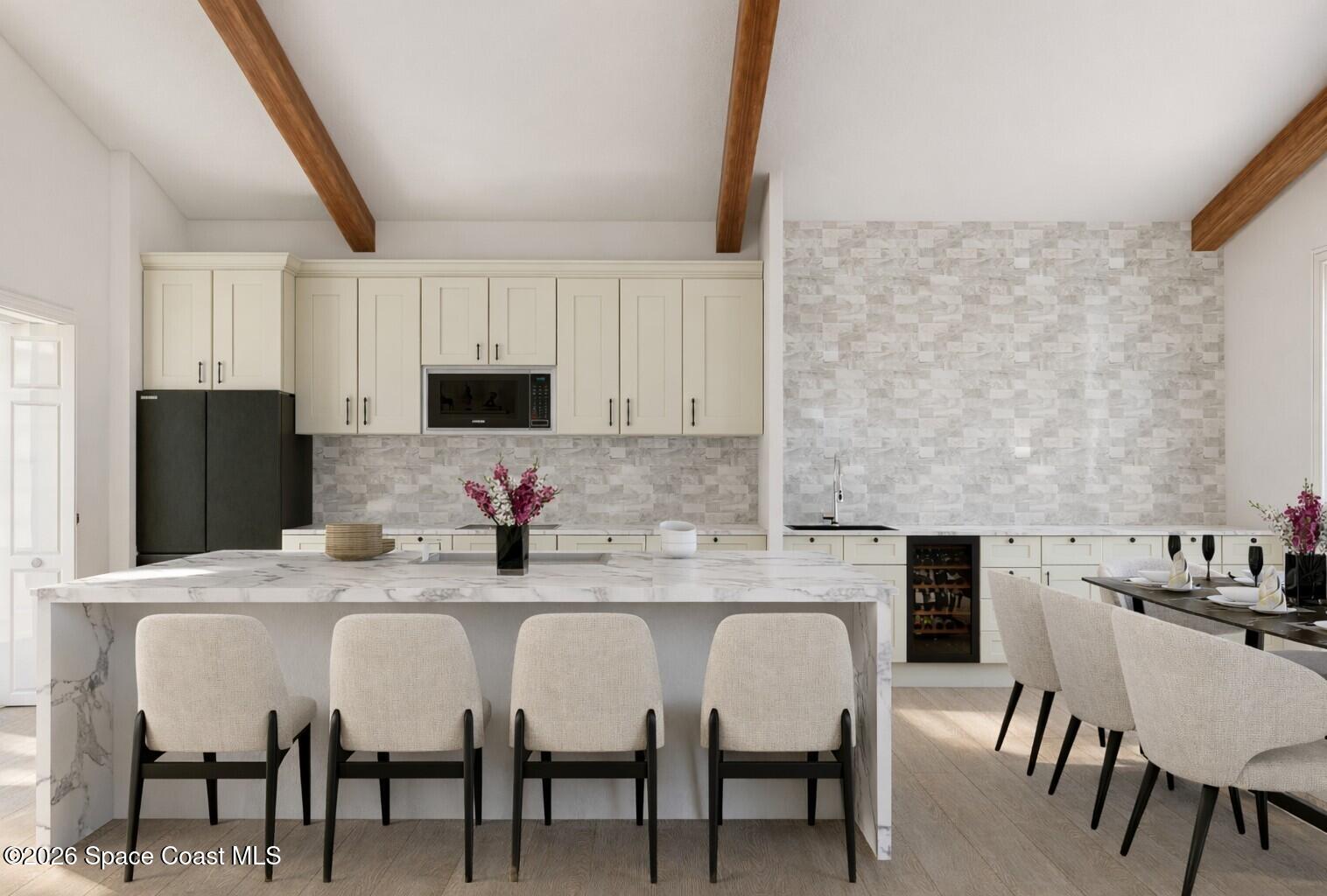 0 Hazel Lane Malabar, FL 32950 - Photo 5 of 17 a kitchen with stainless steel appliances kitchen island granite countertop a dining table and chairs