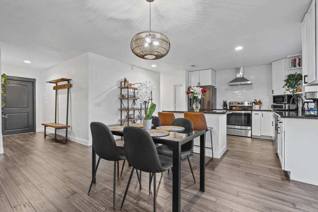 9308 Meadowheath Drive Austin, TX 78729 - Photo 11 of 40 a view of a dining room with furniture and wooden floor