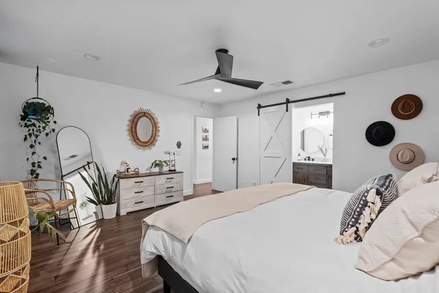 a bedroom with a bed and cabinets
