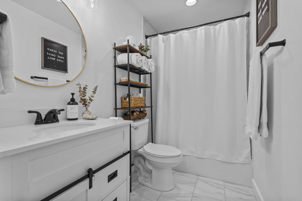 9308 Meadowheath Drive Austin, TX 78729 - Photo 26 of 40 a bathroom with a sink toilet and shower
