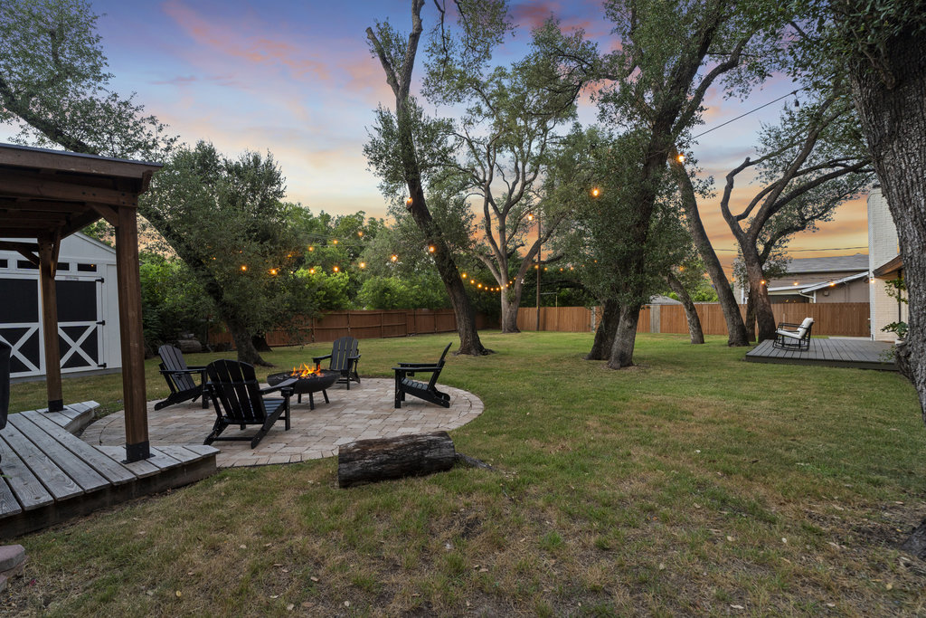 9308 Meadowheath Drive Austin, TX 78729 - Photo 34 of 40 a view of a park with bench and trees